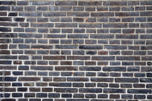 Weathered old brick wall with white insert