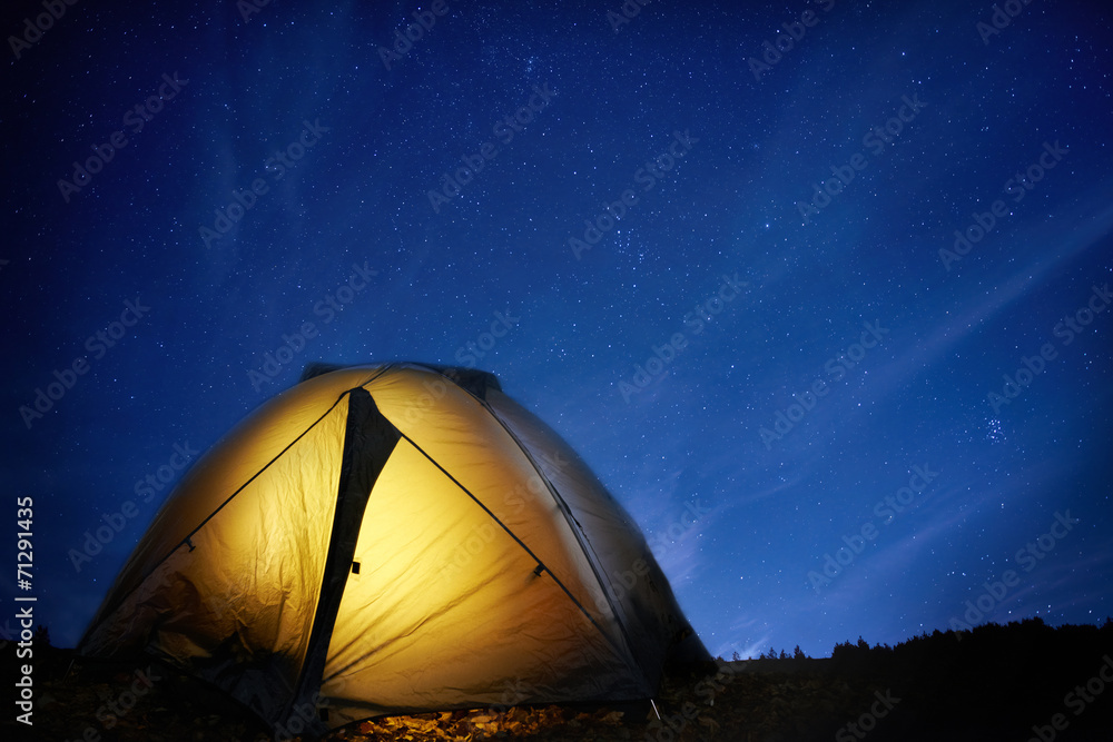 Illuminated yellow camping tent