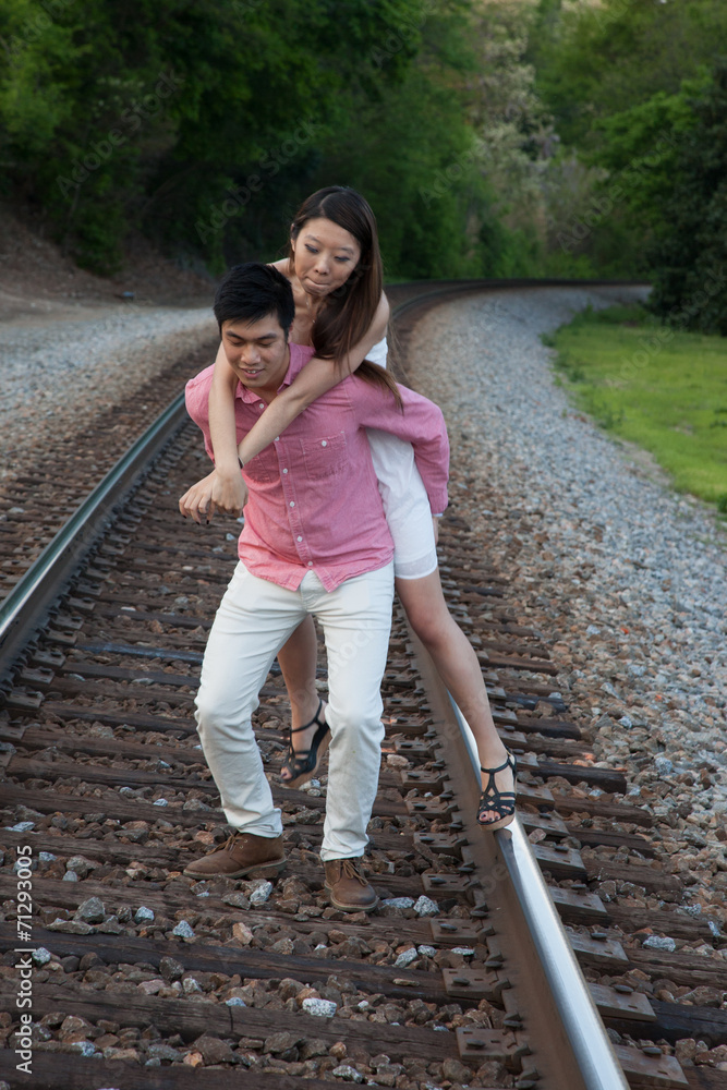 Obraz premium Romantic Asian couple playing outside