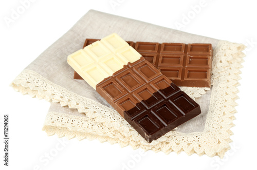 Chocolate bars on napkin isolated on white
