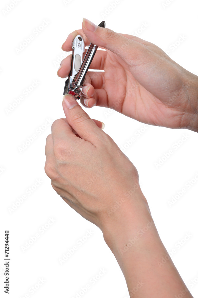 woman hand manicure with nail clipper woman hand manicure with nail clipper