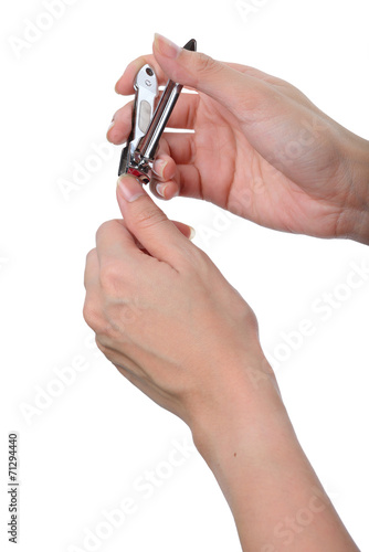 woman hand manicure with nail clipper