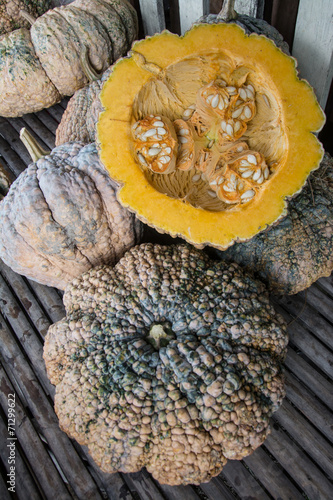 Autumn pumpkins with leaves on wood 