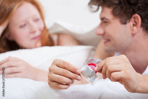 Teenage boy with condom
