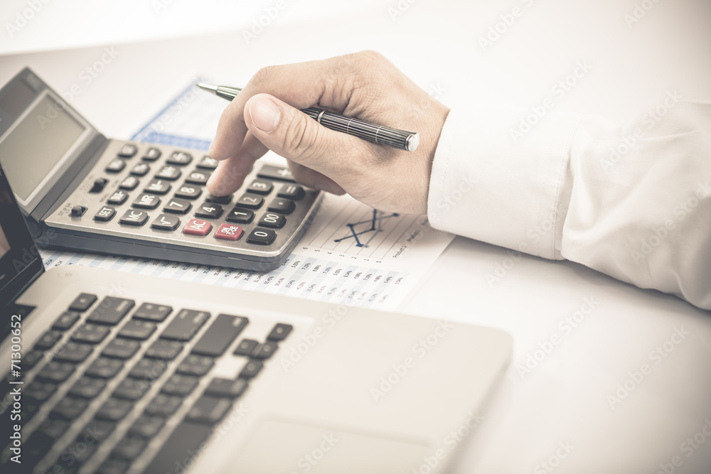 Businessman analyzing investment charts with laptop. Accounting Businessman analyzing investment charts with laptop. Accounting