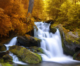 Autumnal landscape with waterfall