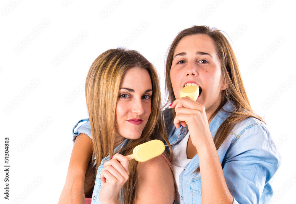 Friends eating ice cream over white background Friends eating ice cream over white background