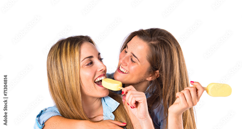 Friends eating ice cream over white background Friends eating ice cream over white background