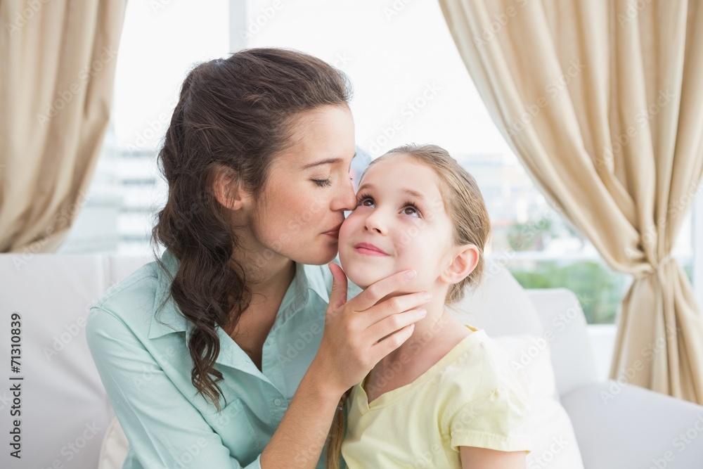Cute mother and daughter on the couch Cute mother and daughter on the couch
