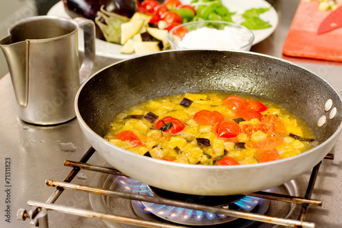 saute vegetables cooking inside pan