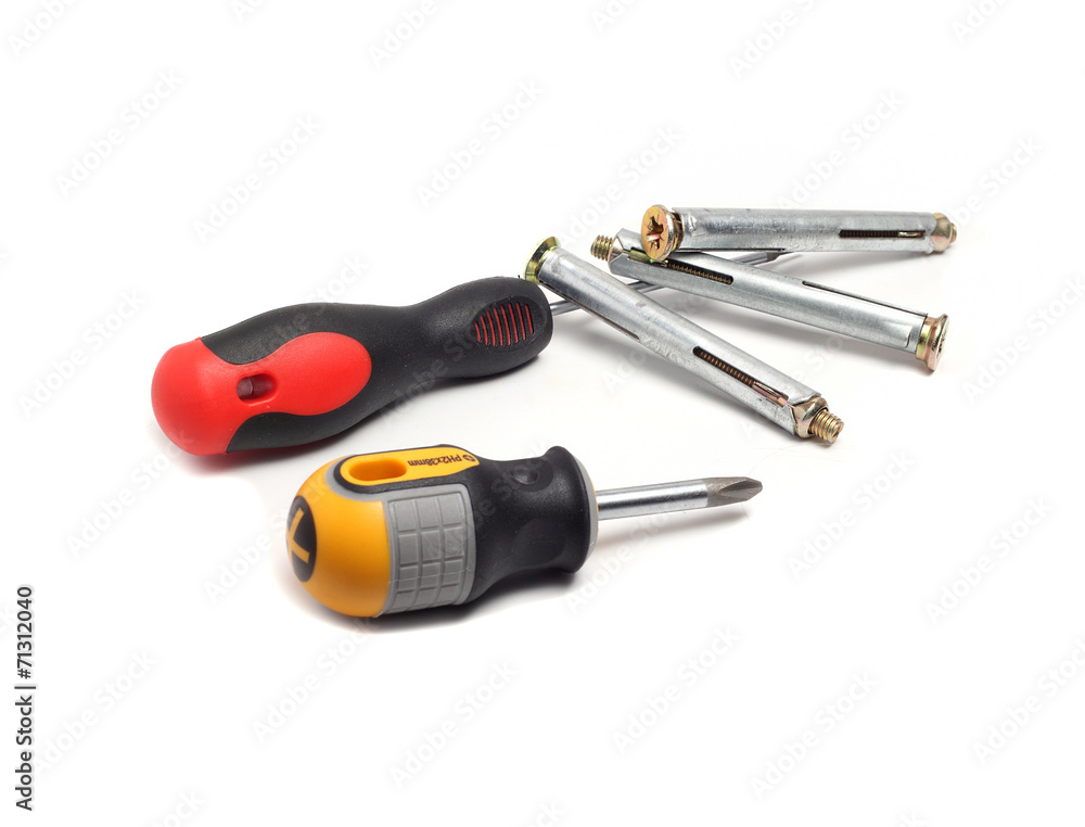 screwdrivers and anchor bolts on a white background screwdrivers and anchor bolts on a white background