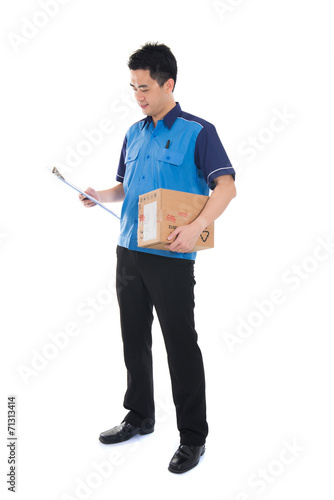 courier in blue uniform sending a package