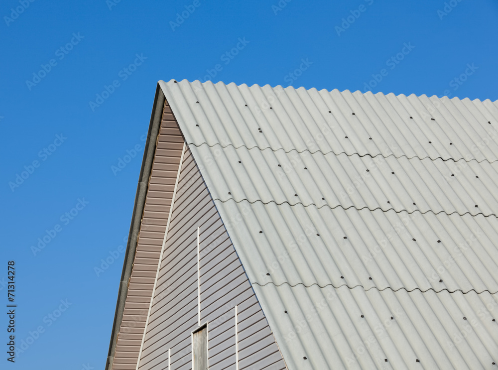 Brand new roof slate roofing against blue sky