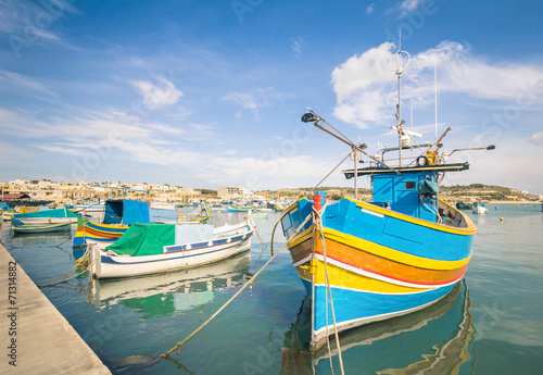 Colorful typical boats in Marsaxlokk - Malta photo