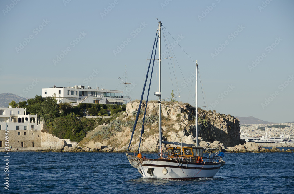 Tradinional wooden cruise boat near coastline