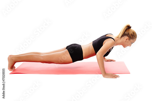 Fitness girl doing push ups