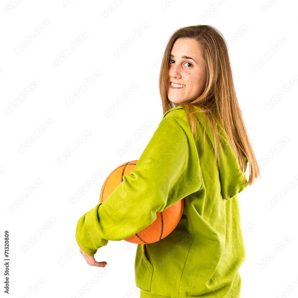 Pretty young girl wearing urban style with basketball Pretty young girl wearing urban style with basketball
