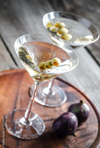 Two olive martini cocktails