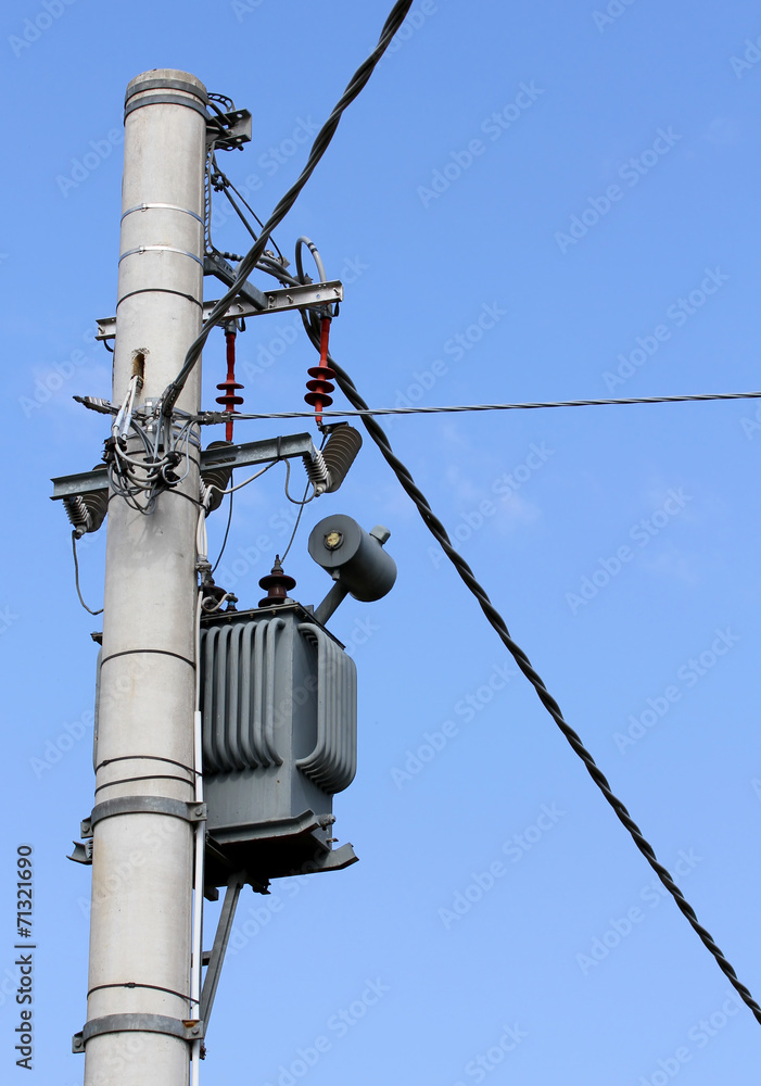 electricity transformer with cables on a pylon electricity transformer with cables on a pylon