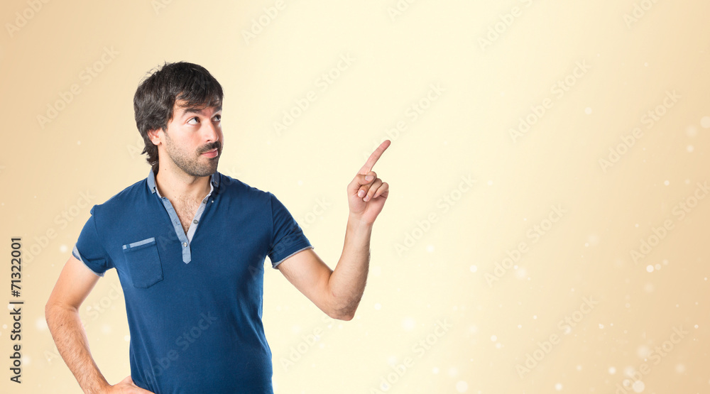 Man thinking over ocher background Man thinking over ocher background
