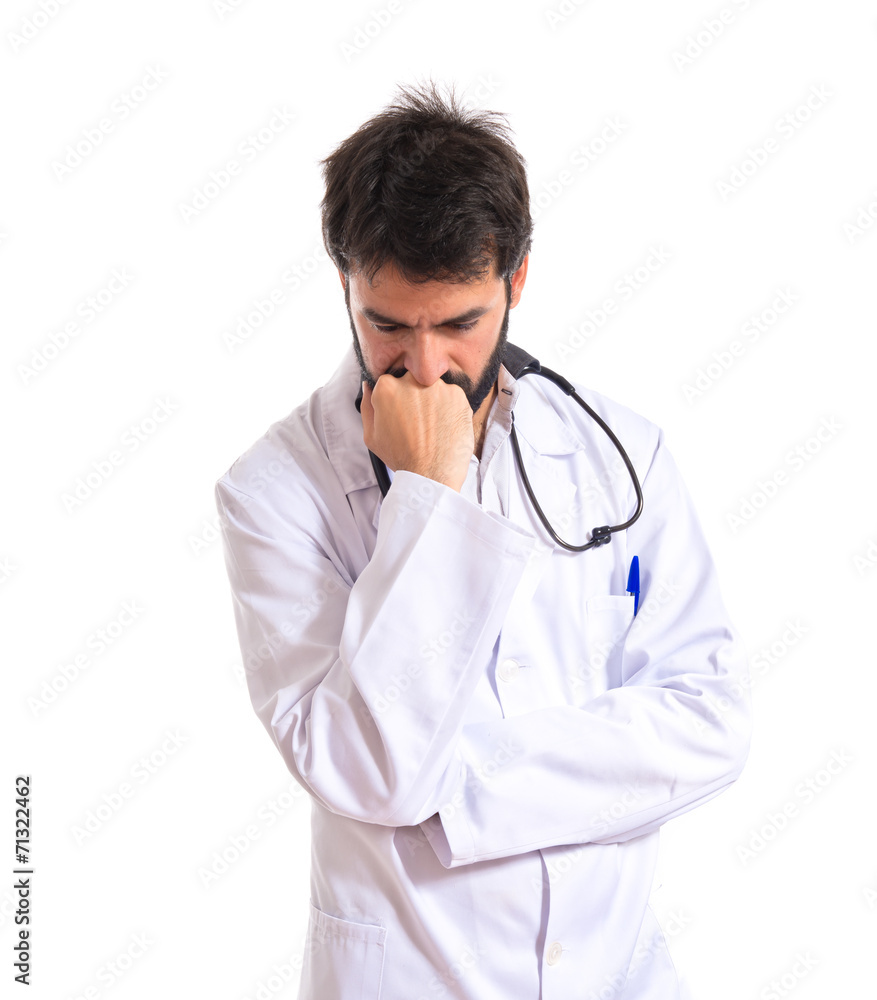 Doctor thinking over isolated white background Doctor thinking over isolated white background
