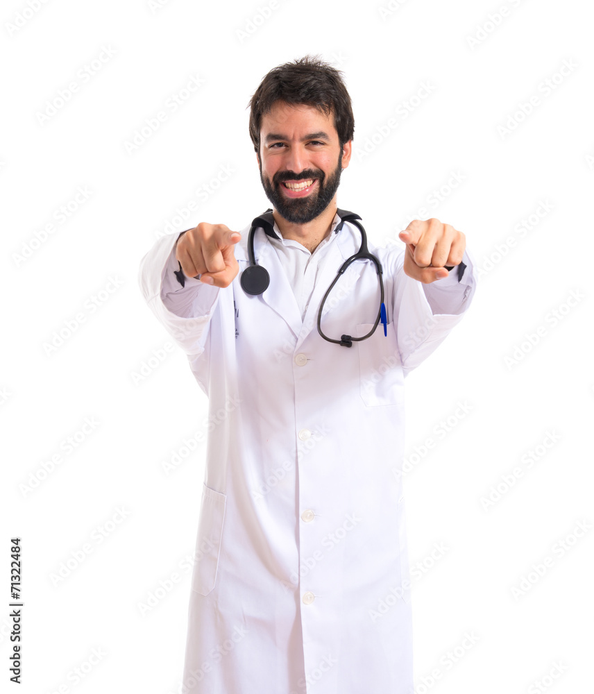 Doctor pointing to the front over white background Doctor pointing to the front over white background