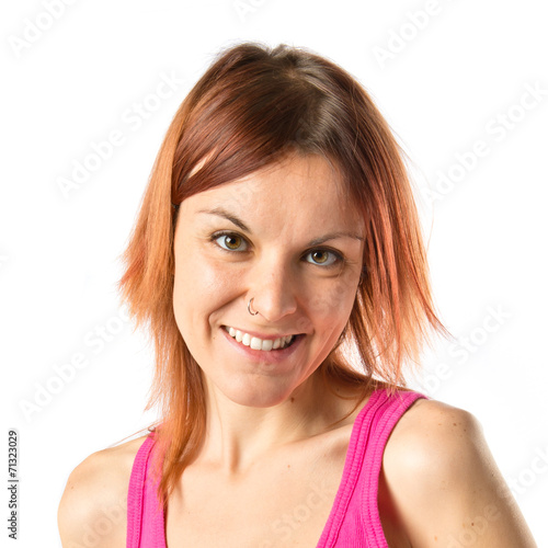 Redhead girl over isolated white background © luismolinero