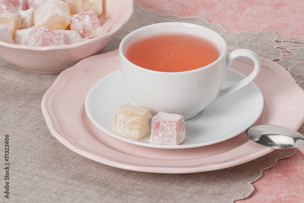 Assorted Turkish Delight. Cup Of Fruit Tea. Natural Linen Napkin Assorted Turkish Delight. Cup Of Fruit Tea. Natural Linen Napkin