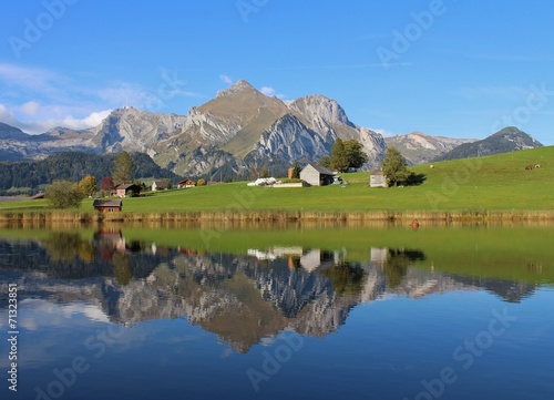 Seantis mirroring itself in lake Schwendisee photo
