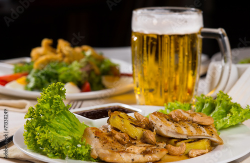 Close up Meat and Vegetable Dish with Beer