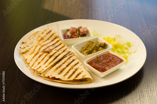 Grilled Quesadilla with Fixings on Plate