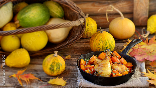 the baked chicken with pumpkin in a pig-iron frying pan