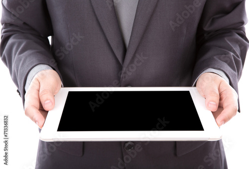 Portrait of young business man using a touch screen device again
