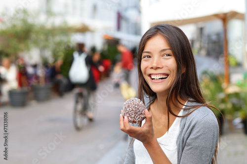 Fotografija Woman eating traditional danish food floedeboller