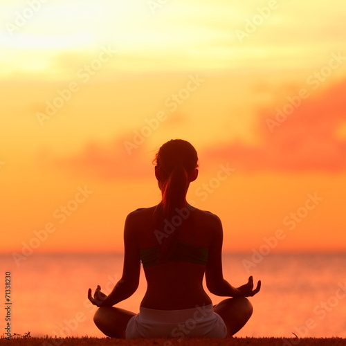 Meditation - Meditating yoga woman at beach sunset