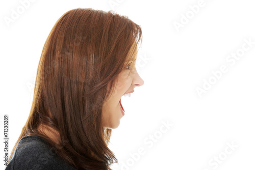 Frustrated and angry woman screaming.