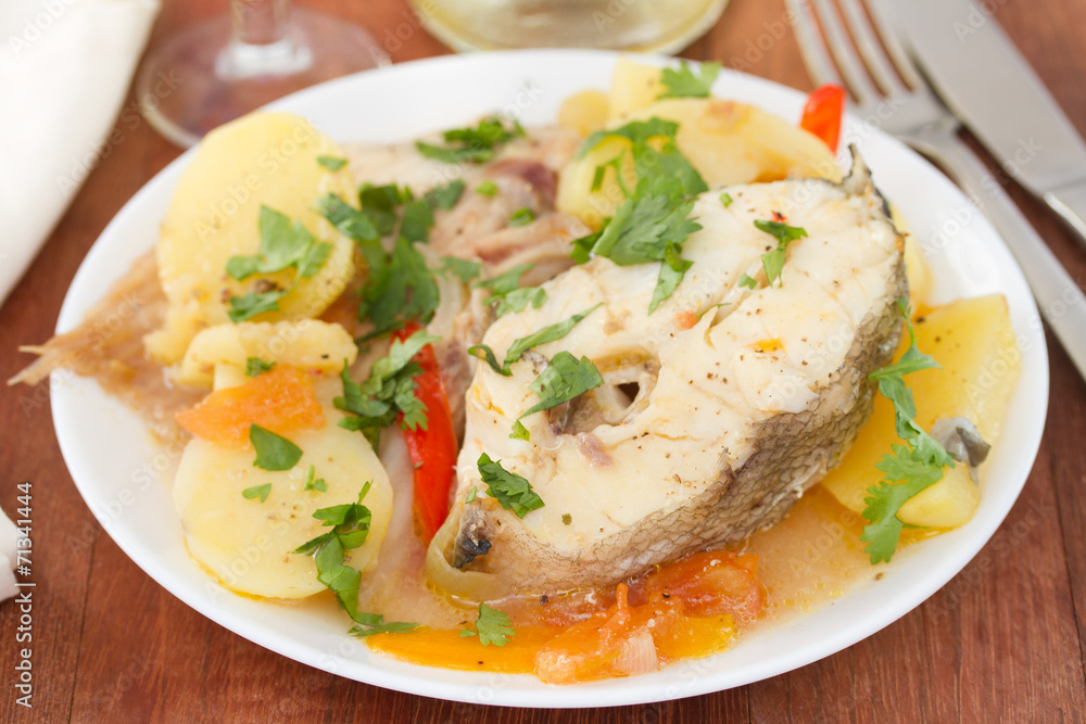 boiled fish with vegetables on white plate boiled fish with vegetables on white plate
