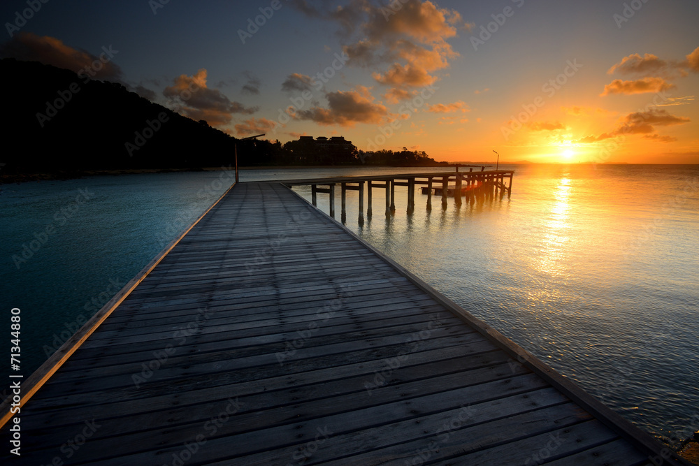 The landscape of beautiful wooden bridge with sunrise