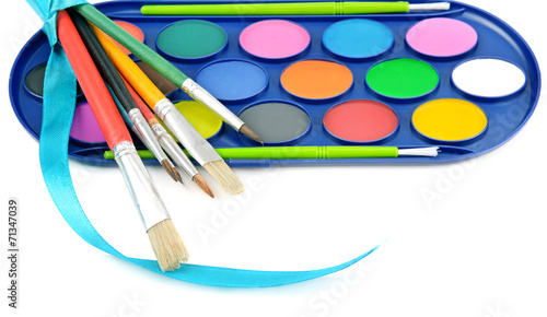 watercolor paints and brushes isolated on white background