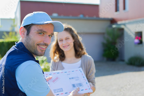 Delivery man handing over a registered letter