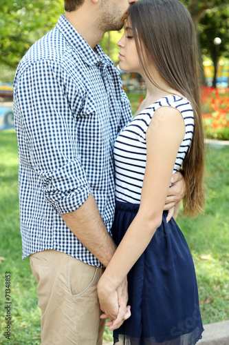 Embrace a loving couple outdoors
