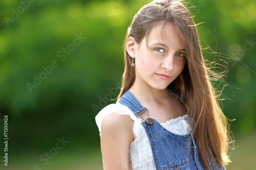 portrait of little girl outdoors in summer © zagorodnaya