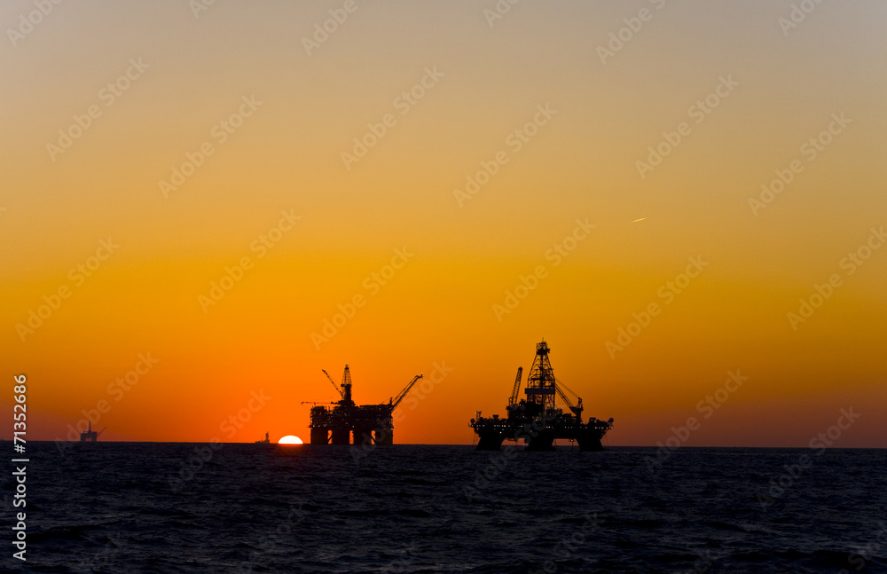 Oil platform silhouette in gulf of mexico