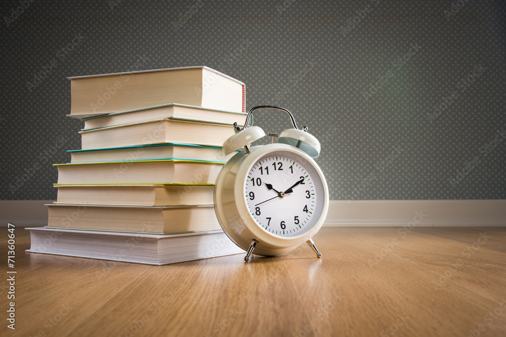 Pile of books with alarm clock Pile of books with alarm clock