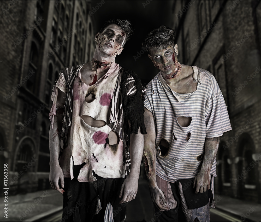 Two male zombies standing in empty city street