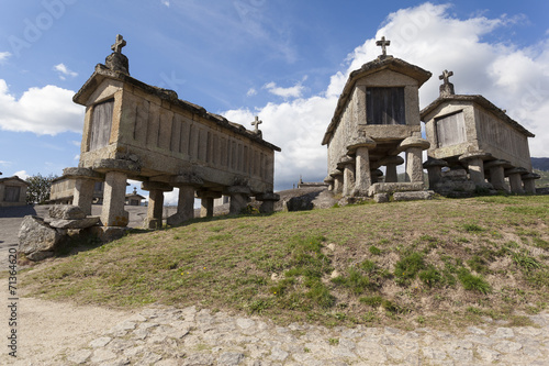 Ancient stone corn driers in Soajo, Portugal photo