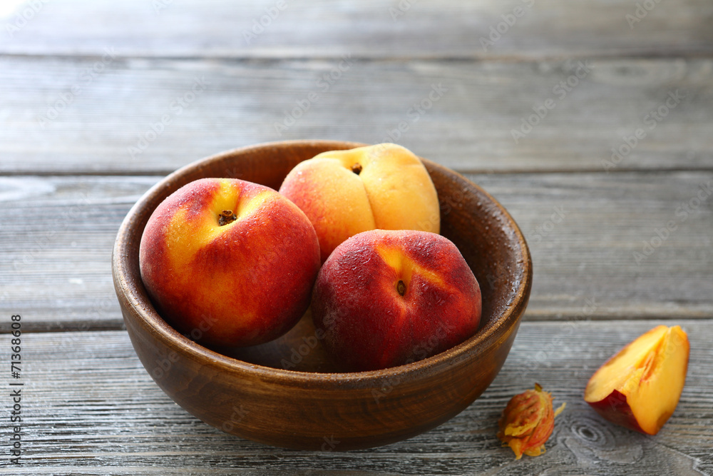 three sweet peaches in a bowl three sweet peaches in a bowl