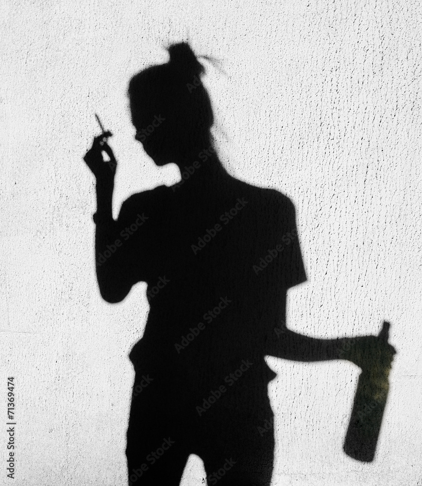 Shadow of sad girl smoking around on wall background Stock Photo | Adobe  Stock