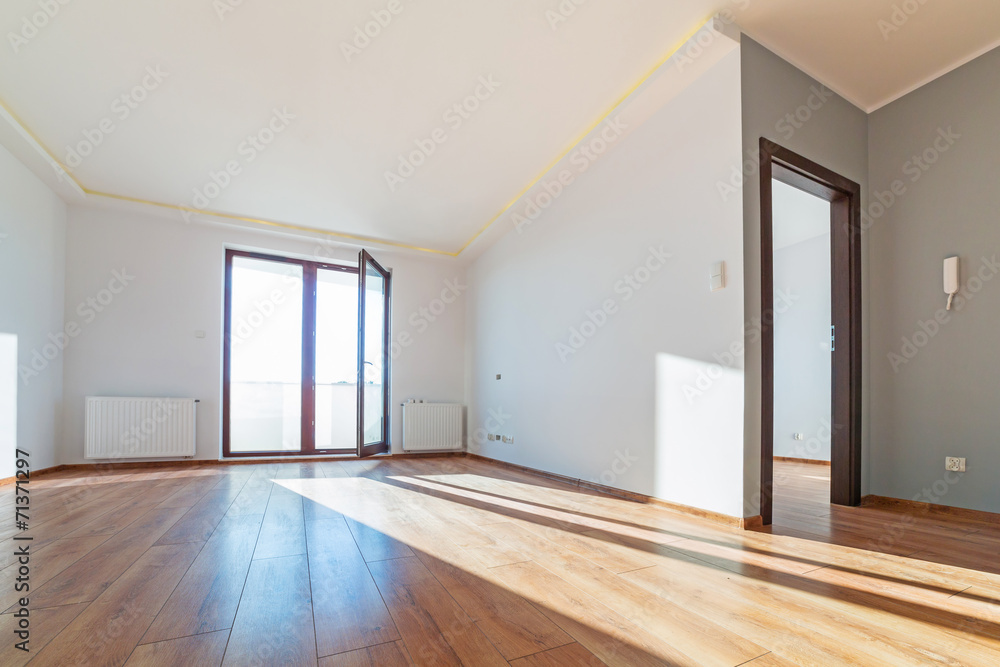 Apartment interior with wooden floor after renovation