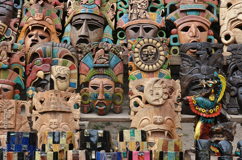 Muliticolored Maya masks - souvenir stall - Chichen Itza – Mexico photo